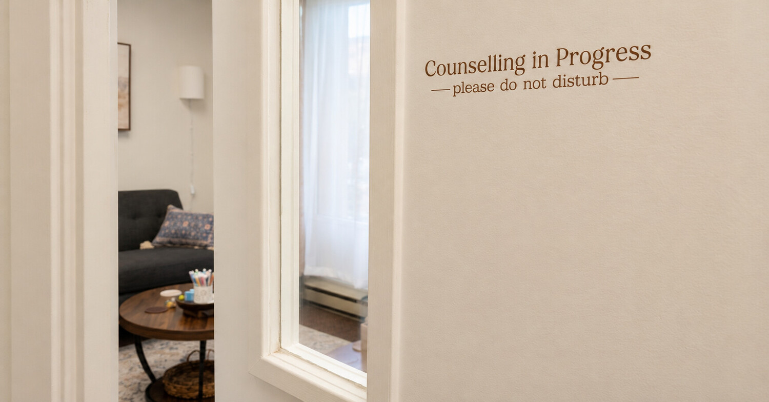 Partly open door leading into the Alicia Norman Counselling office.